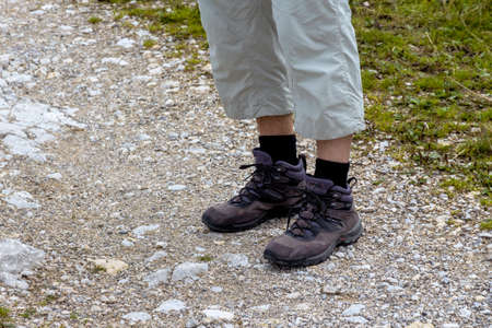 woman in hiking boots, a symbol of outdoor, equipment, activity