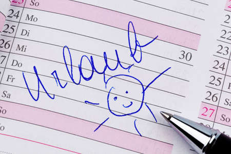 an appointment is entered on a calendar holidaysの写真素材