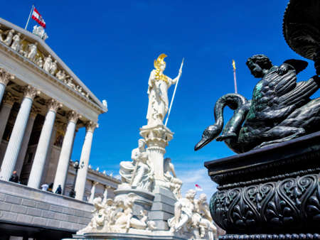 parliament in vienna, austria. with the statue of pallas athena of the greek goddess of wisdom.の写真素材