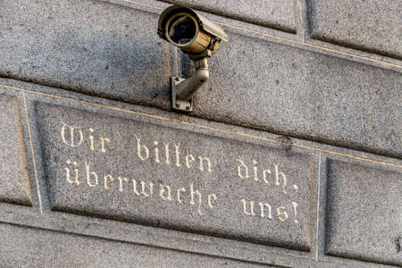 surveillance camera on a building, symbol of monitoring, home security, control, data protectionの写真素材