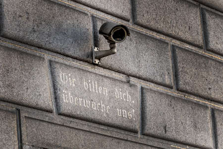 surveillance camera on a building, symbol of monitoring, home security, control, data protection