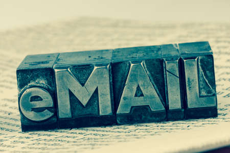 the word e-mail letters written in lead. photo icon for quick correspondenceの写真素材