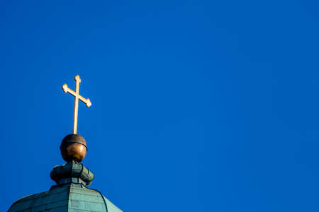 cross on a church tower, symbol of religion, spirituality, freedomの写真素材