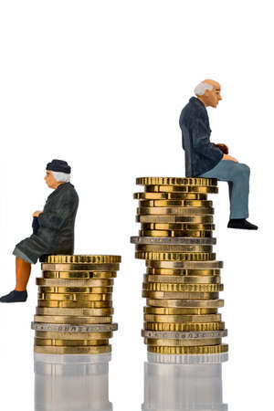 pensioners and pensioner sitting on money stack symbol photo for retirement and inequalityの写真素材