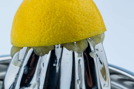 one of squeezed lemon on a white background. symbolic photo for taxes, duties,の写真素材