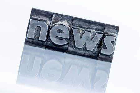 the word news written with lead letters. photo icon for newsletters, newspapers and informationの写真素材