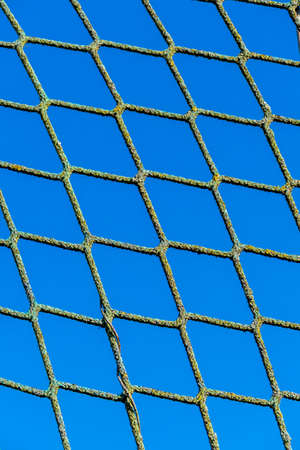 power and blue sky as a symbol of network, captivity, border security