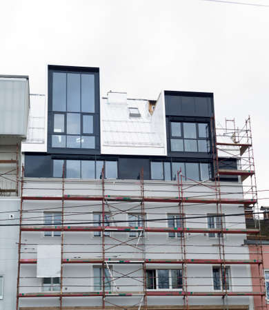 Renovation of an apartment building, a symbol of modernization, capital investment, and insulationの写真素材