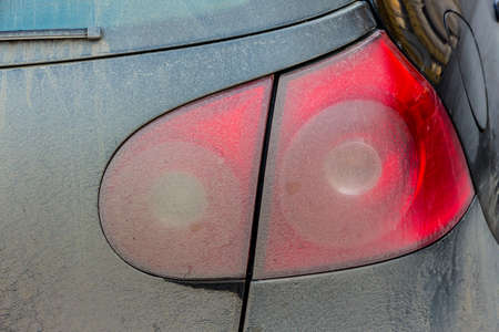 spotted tail light on cars, symbol of dirt, risk of accidents, congestion, poor careの写真素材