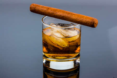 cigar and whiskey. a symbol photo for addiction and relatedの写真素材