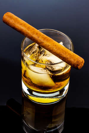 cigar and whiskey. a symbol photo for addiction and relatedの写真素材