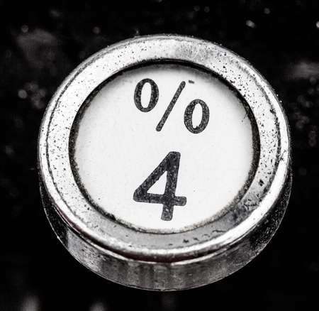 sign percent on a typewriter. symbolic photo for communication in former times