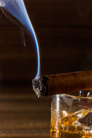 cigar and whiskey. a symbol photo for addiction and relatedの写真素材