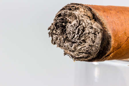 smoking cigar. a symbol photo for addiction and relatedの写真素材