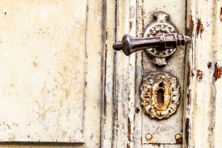 old door with squiggly jack, symbol of decay, the past and the old building