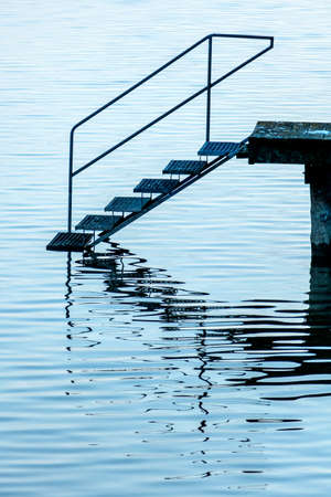 jetty with stairs, symbol of advancement, career, recreationの写真素材