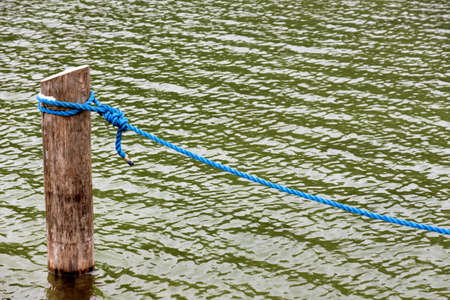 dew on a wooden pole, symbol of reliability, security, nautical, harborの写真素材