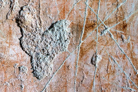 in a wall was carved a heart. symbol for loveの写真素材