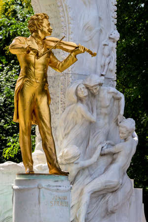 the johann strauss monument stands in the stadtpark.の写真素材