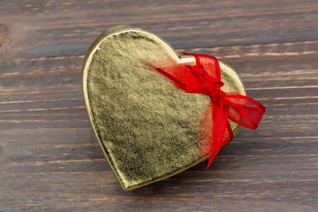 a box for a gift in the form of a heart. symbolic photo for valentine's day, wedding, engagement.の写真素材