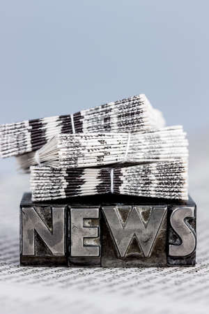 the word news written with lead letters. photo icon for newsletters, newspapers and informationの写真素材