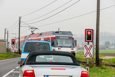 car on a level crossing, symbol for auto transport, rail transport, mobilityの写真素材