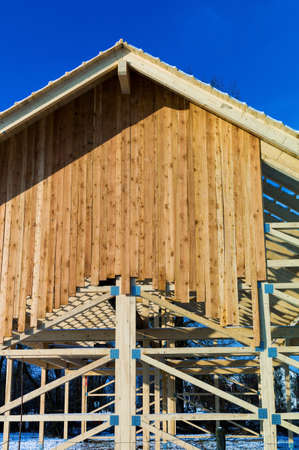 wooden roof construction, symbol photo for home, house building, and house financing