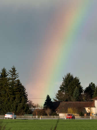after bad weather and rain enjoys a rainbow.の写真素材