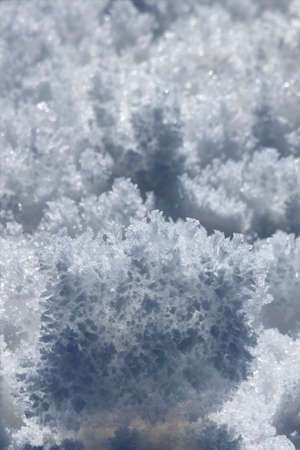 bizarre formations of snow sparkling in the sunの写真素材