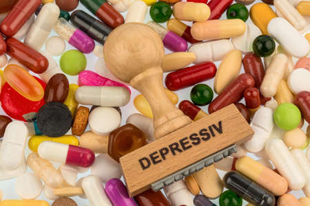stamp on colorful tablets photo icon for depression, therapy and psychotropic drugsの写真素材