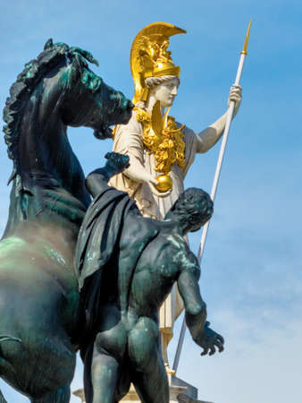 parliament in vienna, austria. with the statue of the "pallas athene" the greek goddess of wisdom.の写真素材