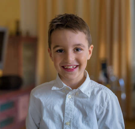 portrait of a boy in front of a white backgroundの写真素材