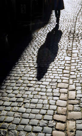 the shadow of a woman on the street.の写真素材