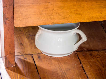 under a bed the night pot is for all cases.の写真素材