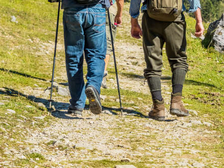 feet with begrschuhen of people hiking. good equipment is importantの写真素材
