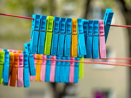 colorful clothespins on a clothes line.の写真素材