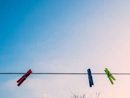 colorful clothespins on a clothes line.の写真素材