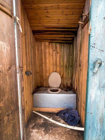 toilet outdoors in a old, abandoned house.の写真素材