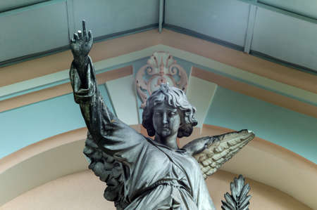 a guardian angel on a grave in a cemeteryの写真素材