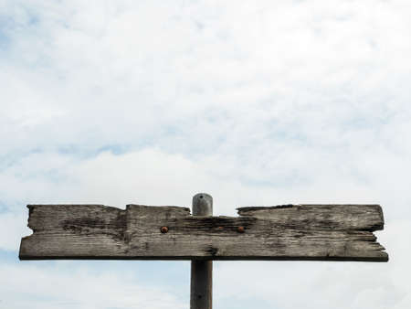 an old wooden signpost without markingの写真素材