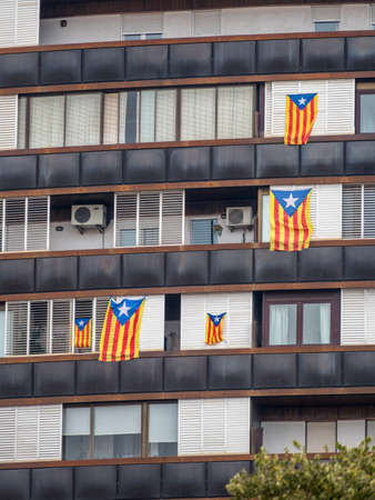 house in barcelona. windows adorned the catalan flagsの写真素材