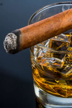 cigar and whiskey. an icon photo for addiction and relatedの写真素材