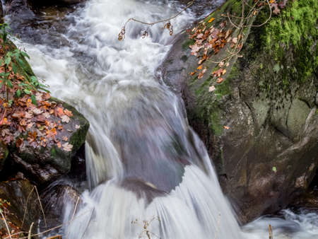 a creek with rocks and running water. landscape experience in nature.の写真素材