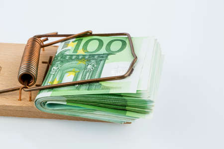 euro notes in mousetrapの写真素材