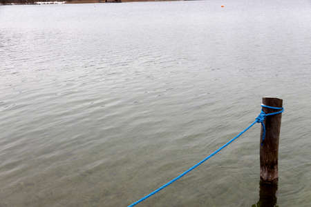 dew on a wooden poleの写真素材