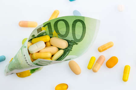 tablets and one hundred euro note