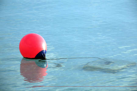 red buoy on the water