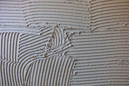 tile adhesive on a wall