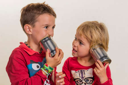 children with a can telephone