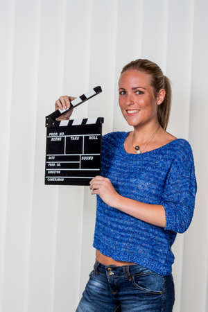 woman with clapperboard